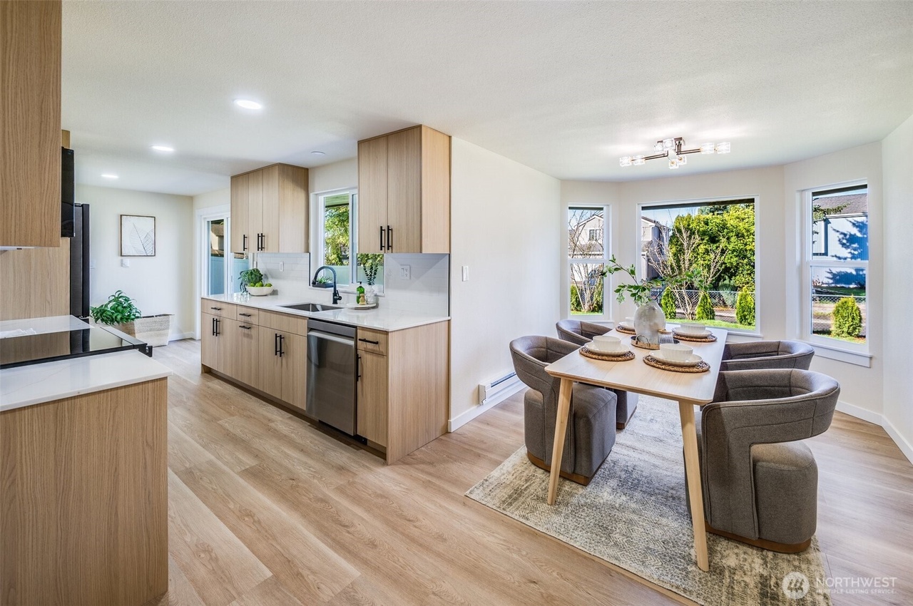 Kitchen remodel project in Seattle WA with Character Oak Modern cabinets quartz countertops island and tile backsplash by RF Remodel