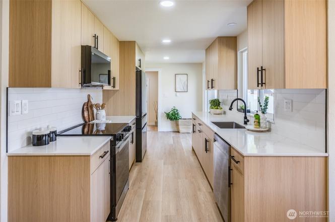 Kitchen remodel photo showing Character Oak Modern cabinetry and quartz countertop