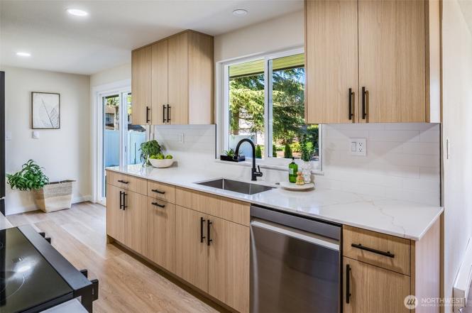 Kitchen remodel detail photo with cabinets countertops and backsplash