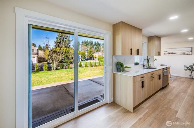 Finished kitchen remodel with Character Oak Modern cabinets and bright layout