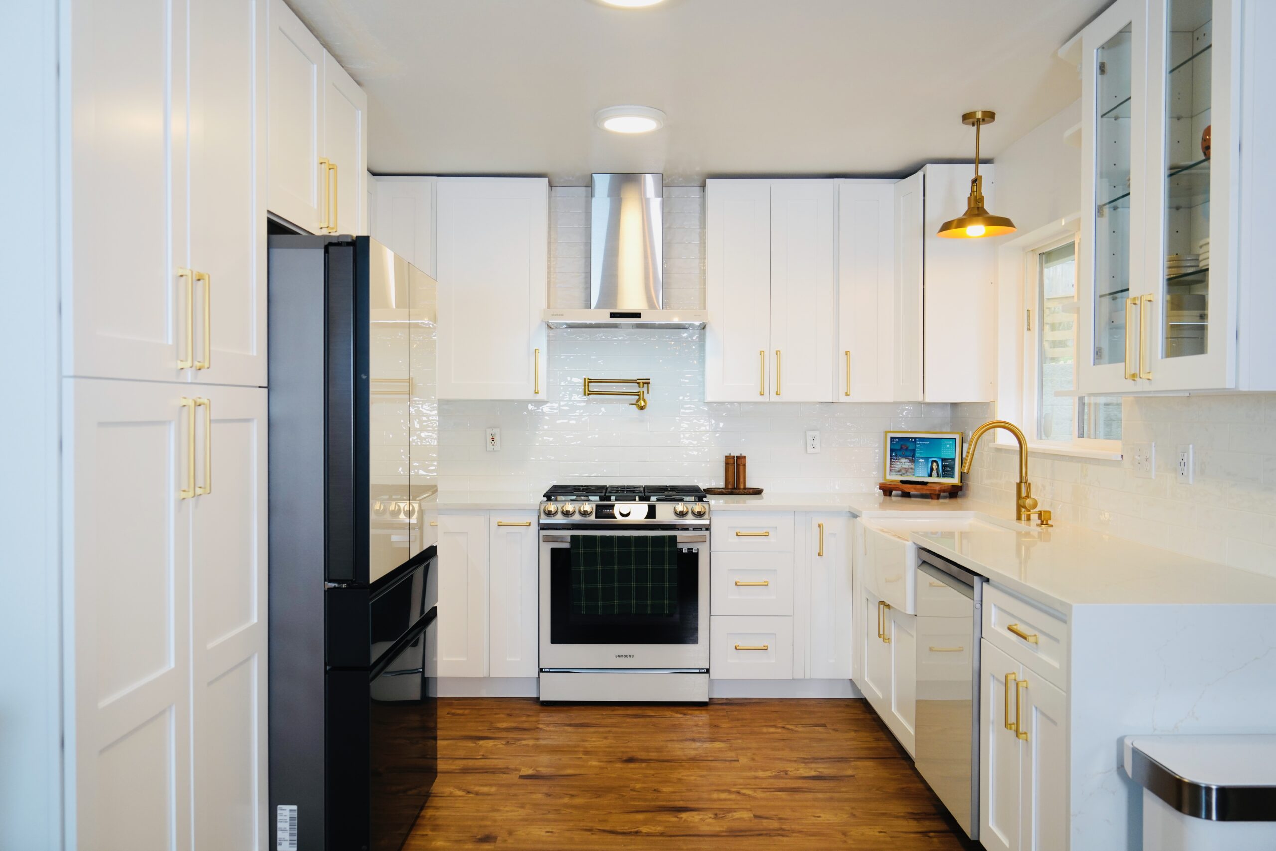 Warm modern kitchen renovation by RF Remodel
